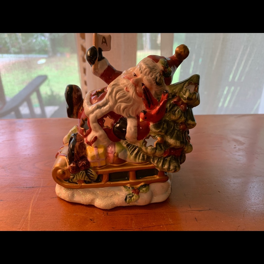 Santa on his sleigh votive candle holder.